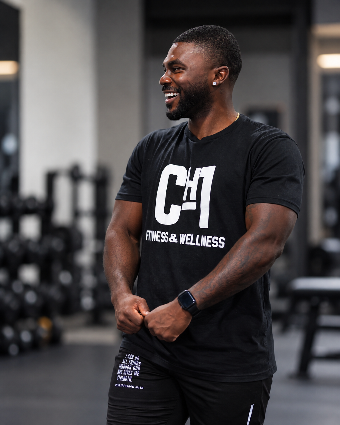Jeremiah Myles in the gym wearing a CH1 Fitness & Wellness shirt